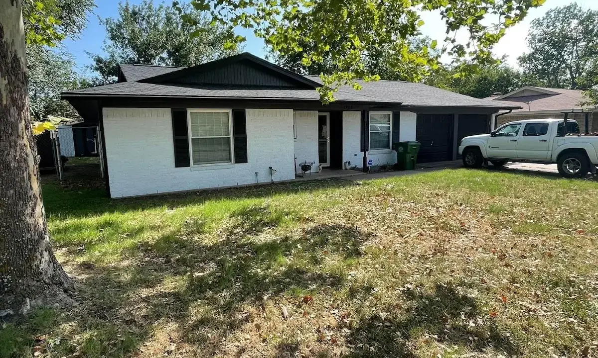 Professional roofing crew working on a residential roof in Flowing Wells